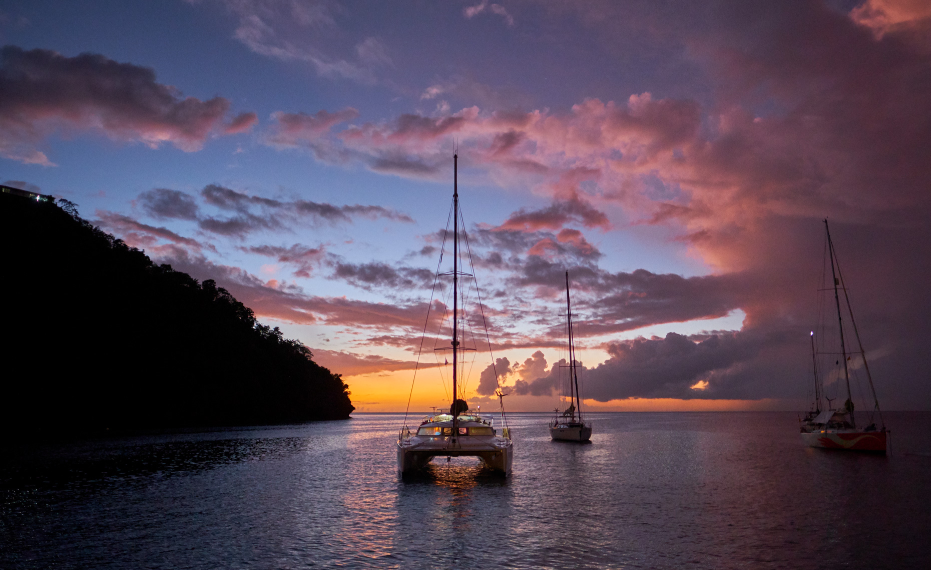 Yacht in pink and orange sunset 